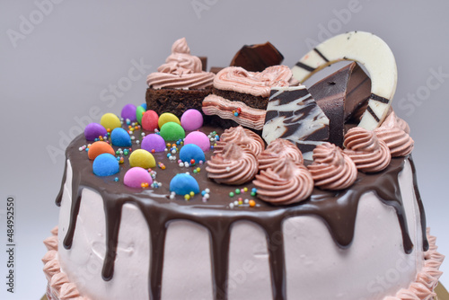 Home made close up shot of beautifully decorated gem chocolate cake