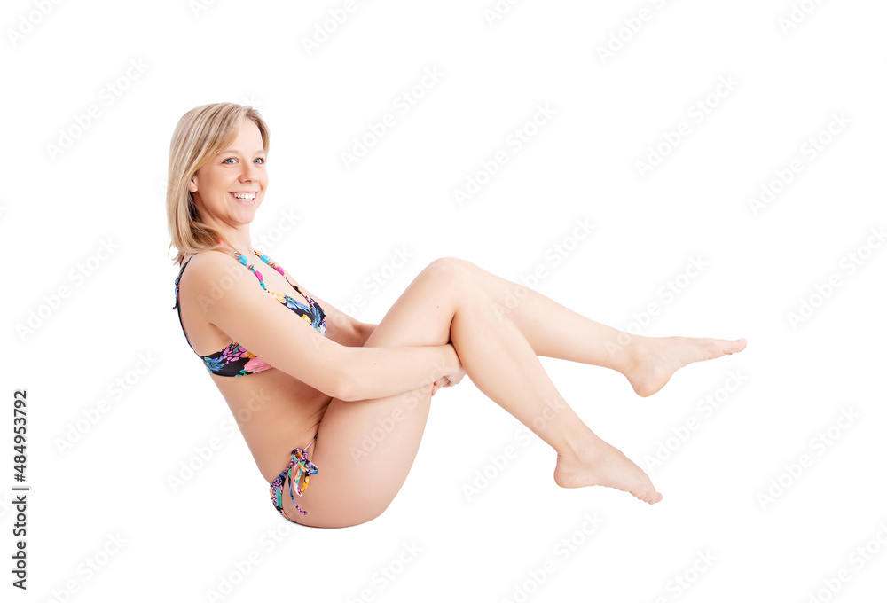 attractive woman wearing a bikini sitting on the floor
