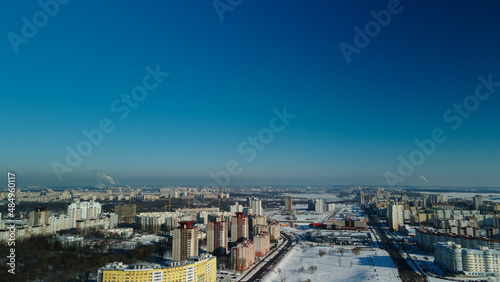 Fototapeta Naklejka Na Ścianę i Meble -  City block. Modern multi-storey buildings. Winter cityscape. Aerial photography.