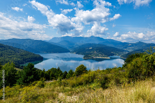The lake Bicaz in carpathian landscape of romania photo