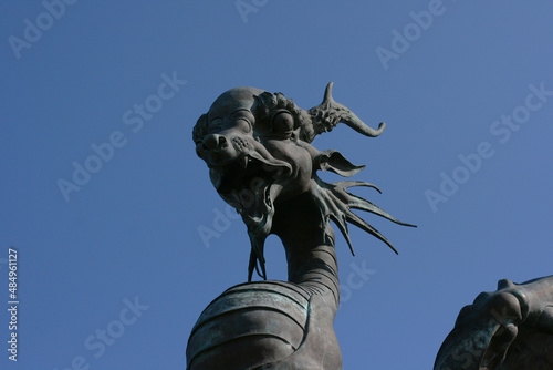 Kazan, Russia - July 13, 2021: Statues of Dragon Zilant at Kazan Wedding Palace (Family Center) at sunset, Tatarstan. It is landmark of Kazan.   photo