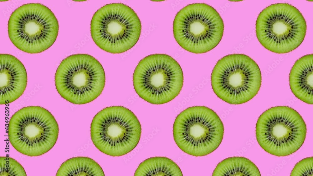 Minimal motion design - Kiwi slices rotating and moving down at pink color background. Trendy colors and style graphics. Seamless looping animation. Minimal motion design - Kiwi slices rotating and moving down at pink color background. Trendy colors and style graphics. Seamless looping animation.