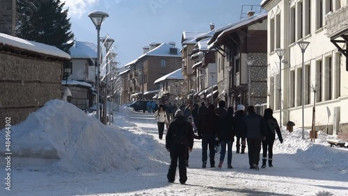 Old streets of Bansko in Bulgaria. Nice Sunny weather. Holidays people relax in the ski resort in the winter photo