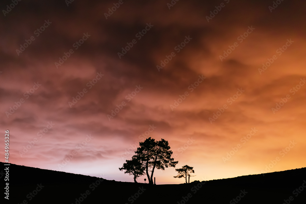 Beautiful orange clouds and silhouettes
