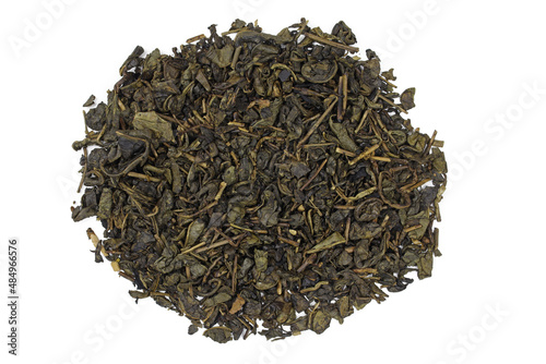 Green tea large-leaf dry on a white background. Dry green tea top view.