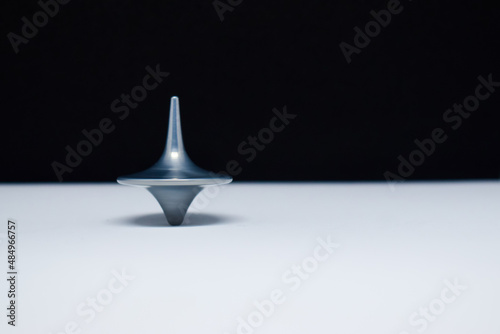 Εκτύπωση καμβά A top is spinning with black and white background , speed is keeping you alive,