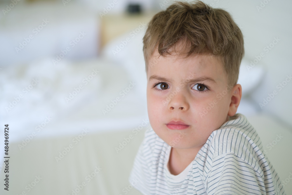 portrait of a boy in the bright interior