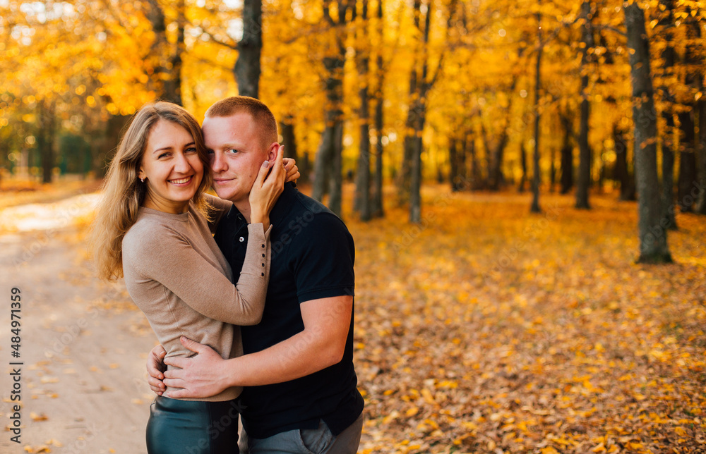 Young couple is having a walk in the sunny autumn park, forest. Happy man and his woman are hugging near yellow tree. Fallen yellow leaves, brith warm autumn weather. Autumn love story in park
Young couple is having a walk in the sunny autumn park, forest. Happy man and his woman are hugging near yellow tree. Fallen yellow leaves, brith warm autumn weather. Autumn love story in park