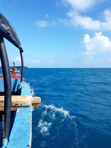 View on ocean from a boat in Zanzibar Tanzania on sunny cloudy weather