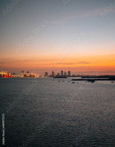 sunrise at the sea sunset colors sky horizon buildings miami 