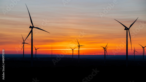 sunset with wind turbine