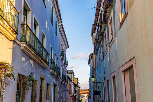 Pelourinho street in Salvador, Bahia with its old colonial-style houses and weathered colored facades and balcony © Fred Pinheiro