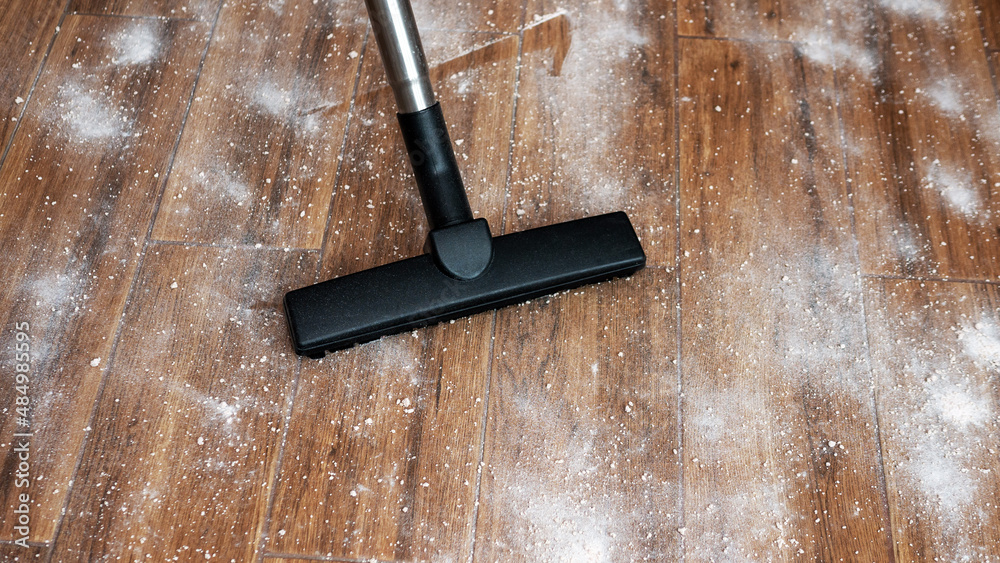 Top view Tiles in the dirt, vacuuming the dirt in the apartment