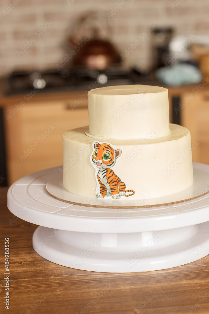 A cake decorated in the style of a tiger for a children's birthday A cake decorated in the style of a tiger for a children's birthday