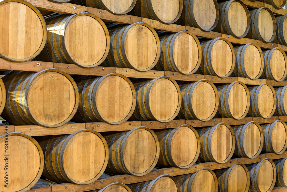Wooden barrels in the wine cellar