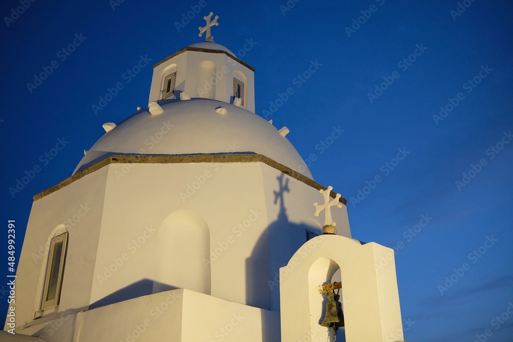 View of a whitewashed Greek Orthodox Church in Fira Santorini Greece at night 