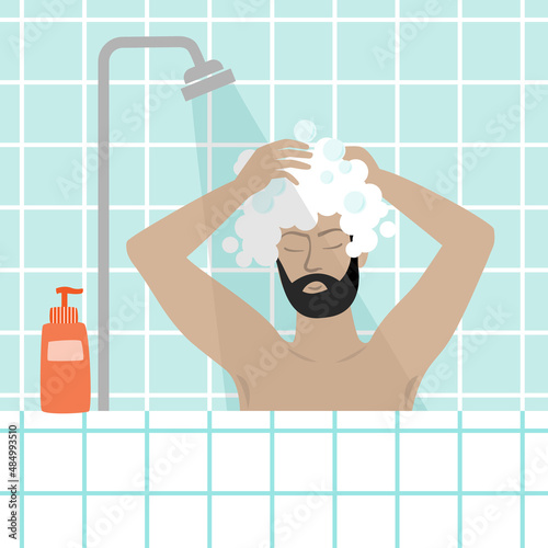 Man taking a shower, washing his hair.