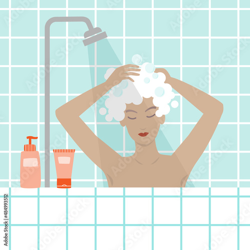 Woman taking a shower and washing her hair.