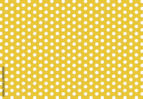 Bright yellow background with white polka dots
