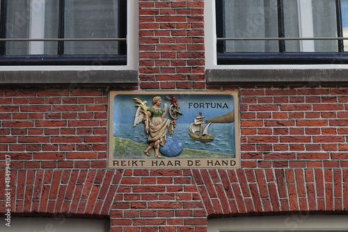 Canvas Print Sculpted Stone Tablet Depicting Lady Fortuna on a Brick Wall in Amsterdam, Nethe