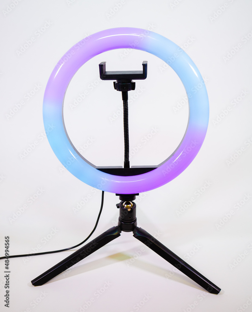 Ring lamp on a small tripod. Purple and blue light. Ring lamp on a small tripod. Purple and blue light.
