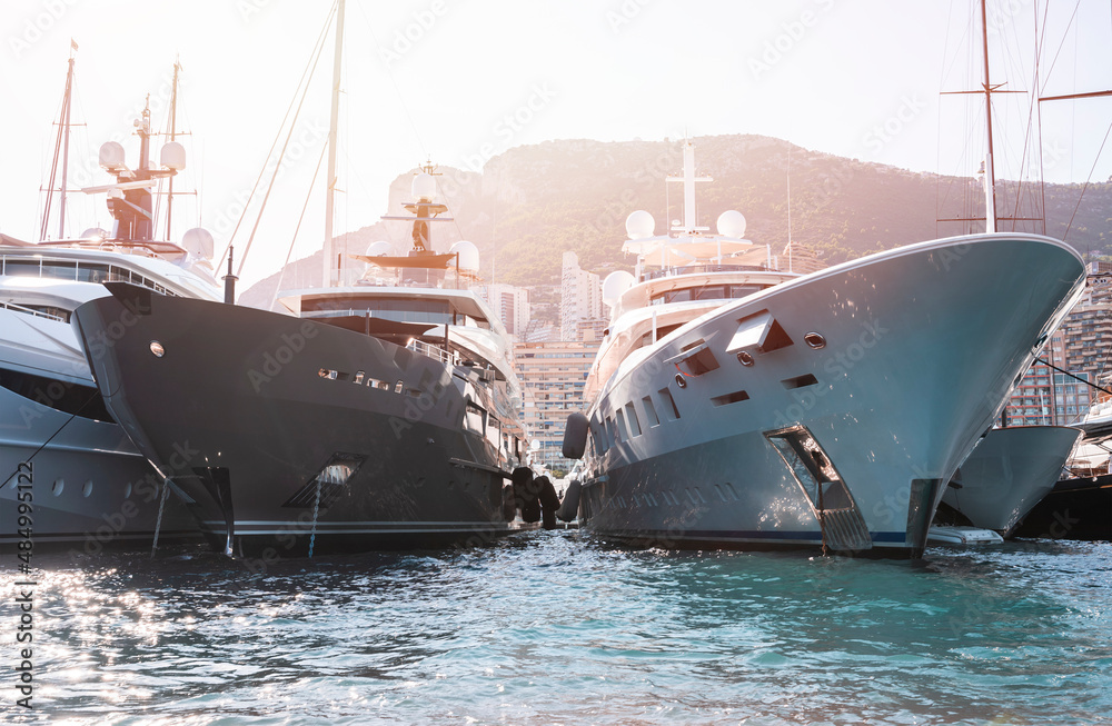 Private super yachts moored in Monaco harbour sunny day Monaco yacht show luxury lifestyle	 - obrazy, fototapety, plakaty 