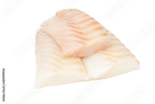 Raw pieces of cod fish loins isolated on white background.