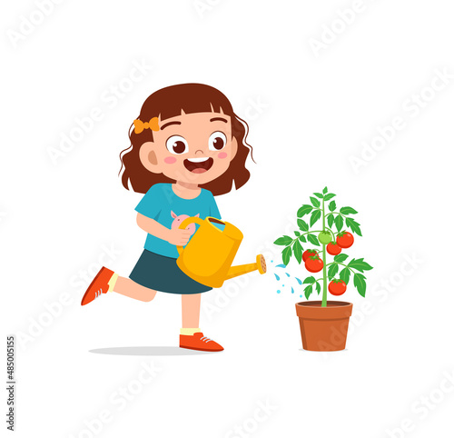 cute little girl stand and watering tomato tree