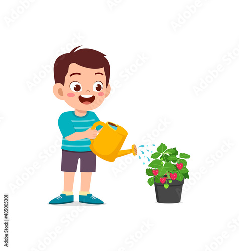cute little boy stand and watering strawberry tree