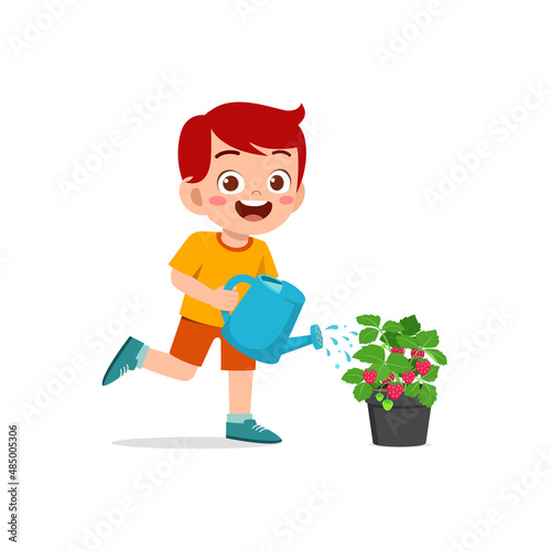 cute little boy stand and watering strawberry tree