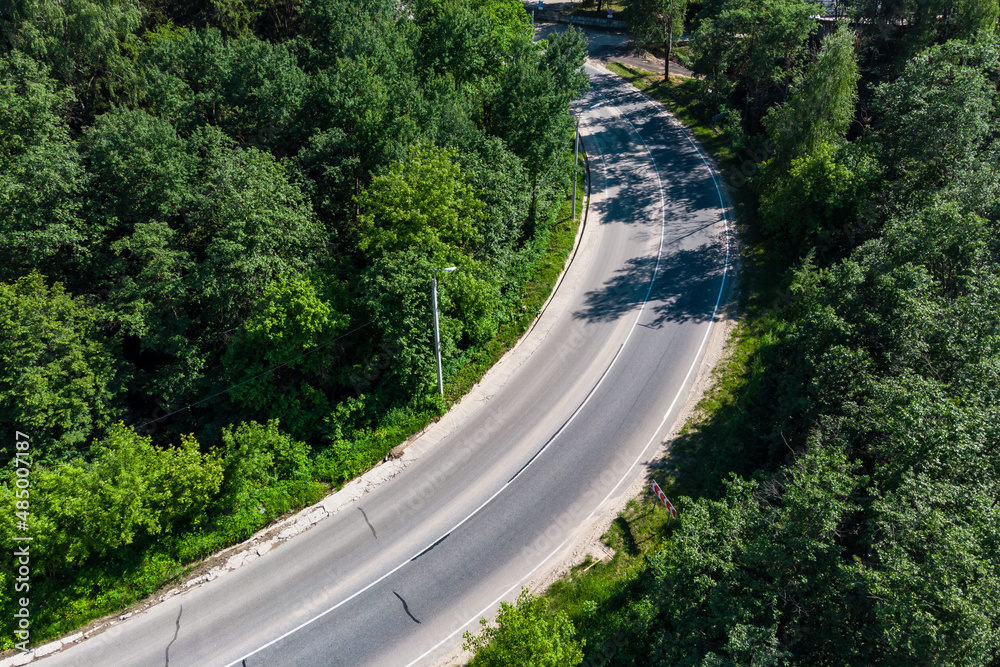 Highway with a dangerous curve without cars, aerial view