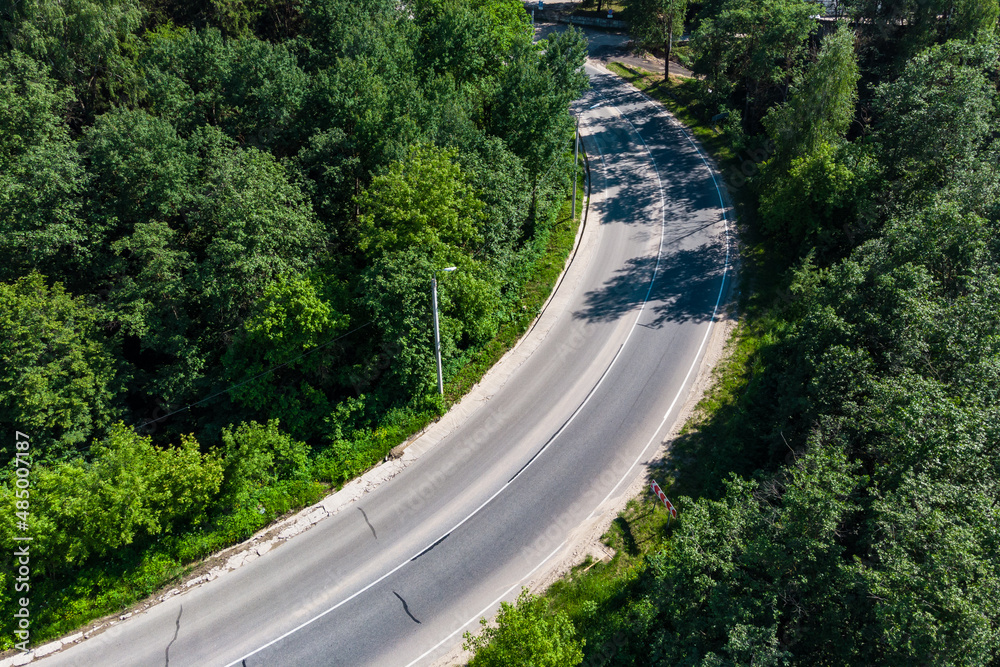 Highway with a dangerous curve without cars, aerial view Highway with a dangerous curve without cars, aerial view