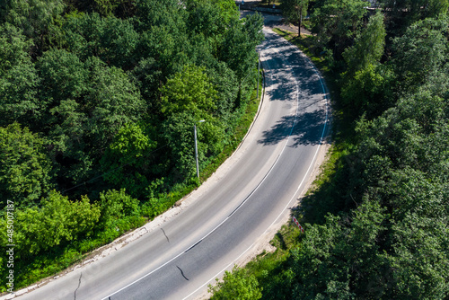 Highway with a dangerous curve without cars, aerial view