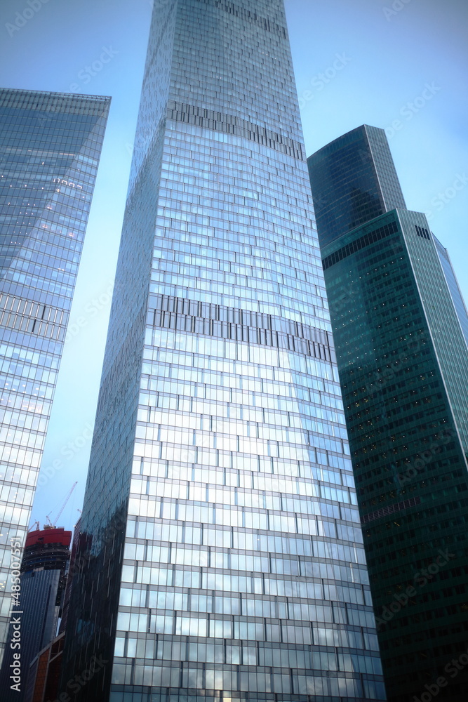 Obraz premium Looking at skyscrapers in the evening. Skyscrapers at dusk.
