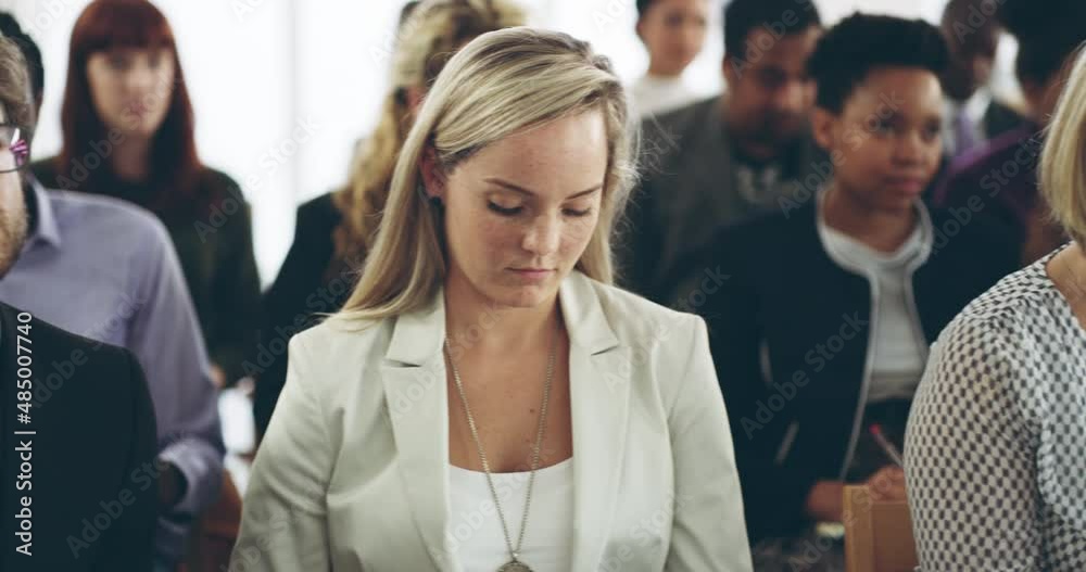 Theres something for everybody at this conference. Diverse group of businesspeople listening and taking notes during a conference. Group of business people sitting in an office during a seminar