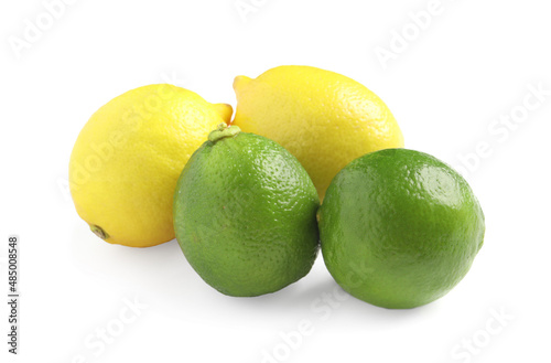 Fresh ripe lemons and limes on white background