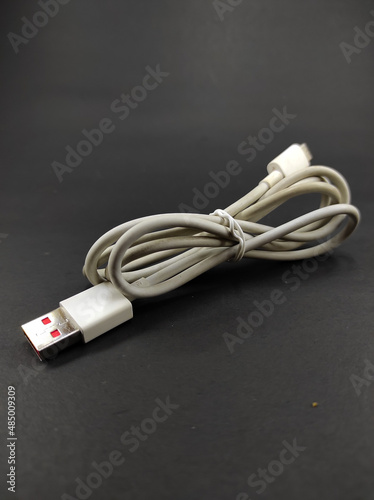 Photo of a white cable isolated on a black background, Not Focus