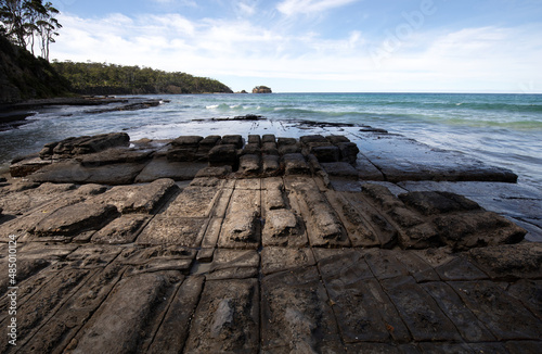 The Tessellated Pavement, located at Lufra, Eaglehawk Neck in Tasmania. It is a well known flat rock surface naturally formed by a series of erosion and concave depression. photo