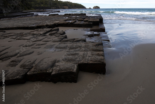 The Tessellated Pavement, located at Lufra, Eaglehawk Neck in Tasmania. It is a well known flat rock surface naturally formed by a series of erosion and concave depression. photo