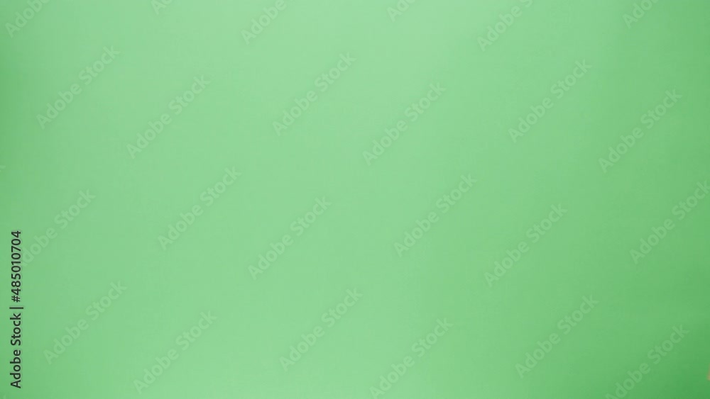 Food delivery service. Square cardboard box on green background. Take away desserts. Online contactless food shopping. Courier giving order, delivering to customer. Food delivery service. Square cardboard box on green background. Take away desserts. Online contactless food shopping. Courier giving order, delivering to customer.