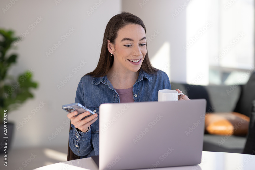 Caucasian woman at home remote working on laptop computer talking to her colleague Caucasian woman at home remote working on laptop computer talking to her colleague