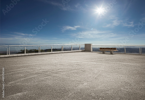 Empty floor ground on rooftop with beautiful sunlight blue sky. photo