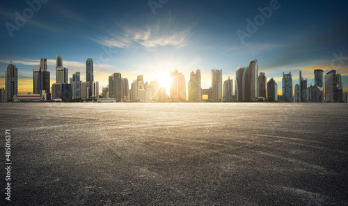 Cityscape with empty tarmac floor. sunset scene. Image composite