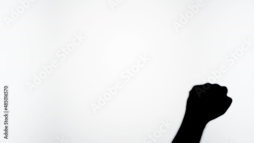 Wallpaper Mural Man showing fist protest gesture with fingers isolated on white background. Male person making shadow silhouette with hand close-up. Torontodigital.ca