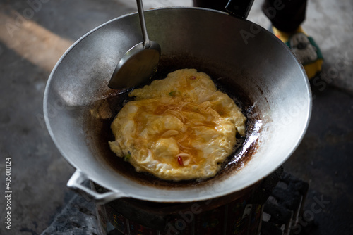 Thai style omelet in Thai street food restaurant