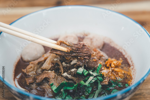 Braised beef clear noodle with meat ball soup stew photo