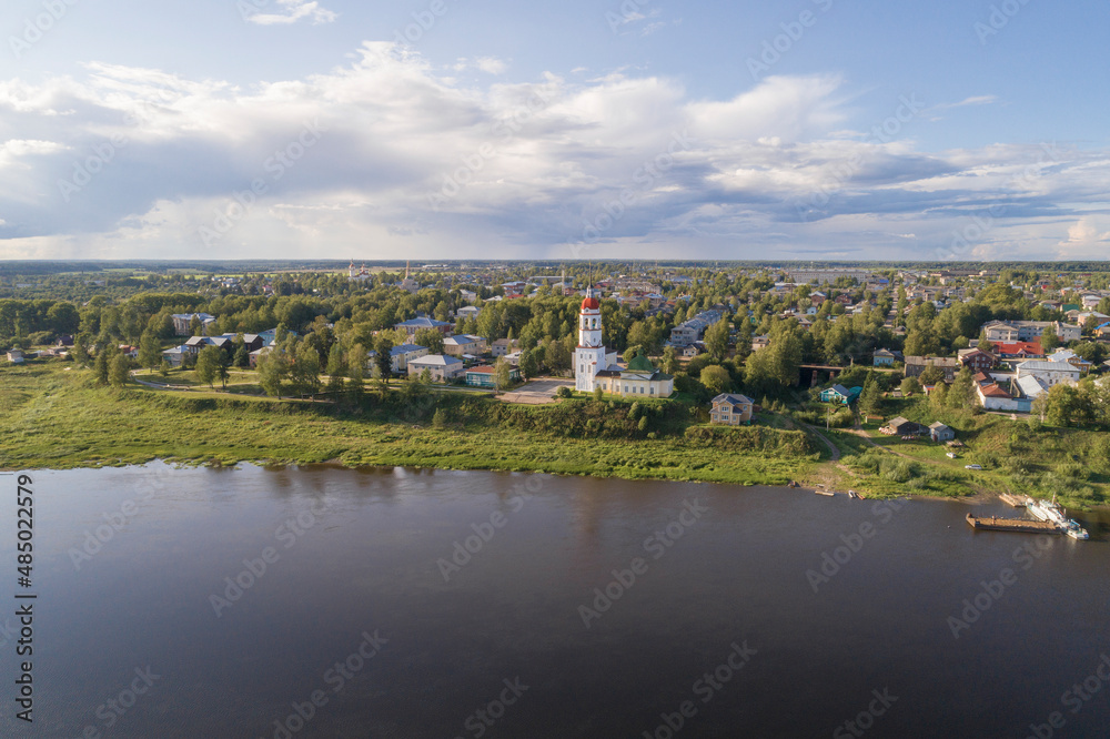 Ancient Assumption Church with a bell tower in the cityscape on August day (aerial view). Totma, Vologda region. Russia