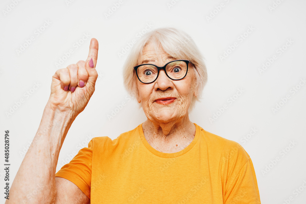 Portrait of an old friendly woman vision problems with glasses light background Portrait of an old friendly woman vision problems with glasses light background