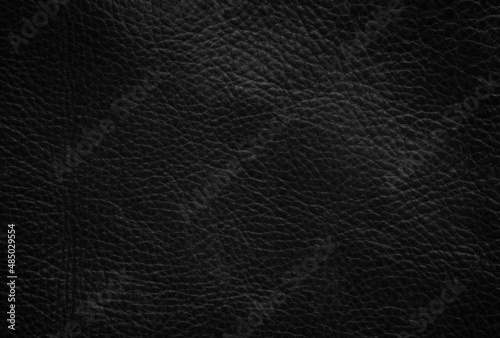 Closeup of seamless black leather texture background, surface material for fashion dark pattern luxury exclusive.