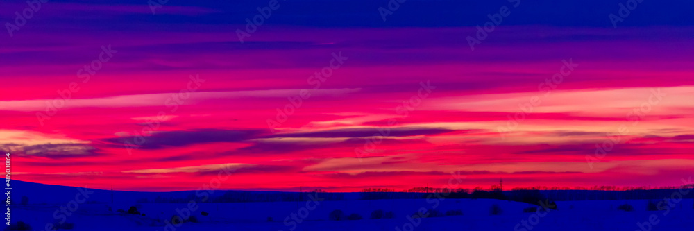 Beautiful sunset sky abstract background in winter. Sky with red pink clouds. Nature background. Beautiful sunset sky abstract background in winter. Sky with red pink clouds. Nature background.